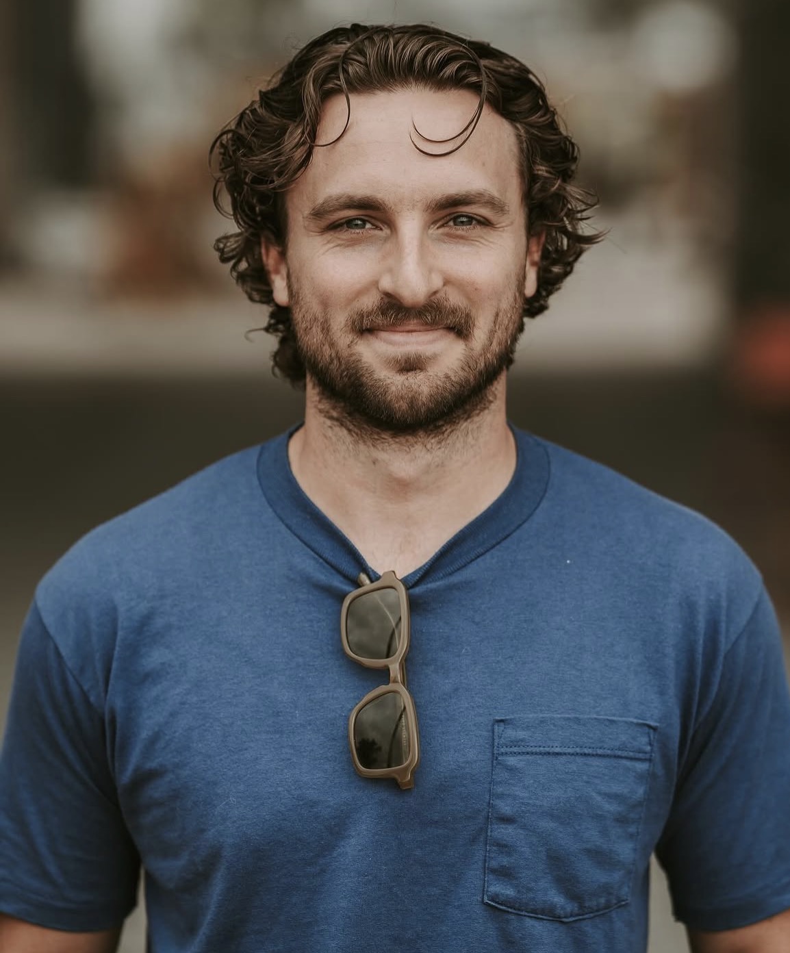 Longer curly cut with a trimmed short beard at The Cave, Rogers AR